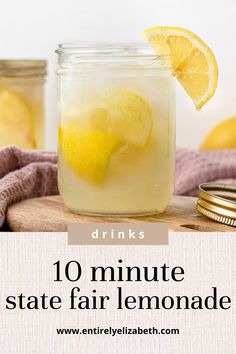 a mason jar filled with lemonade sitting on top of a wooden table