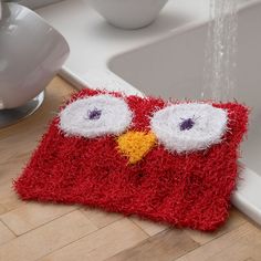 a bathroom rug with an angry bird on it and the words knit owl dish scrub free pattern