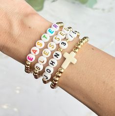 ☦️The listing is for one bracelet. Perfect for adding to a stack of wearing alone! Bracelets make a great gift!  ☦️Gold bracelets are made with 14k gold plated beads in 5mm. Choose your own word, phrase of bible verse and letter bead color.  ☦️Be sure to enter your word or bible verse of choice in the personalization section. If ordering the cross bead bracelet, enter NA for not available since it does not require personalization.    ☦️Bracelet makes a perfect Easter gift for the one you love! Spiritual Custom Name Bracelets For Personalized Gift, Spiritual Custom Name Bracelets As Personalized Gifts, Spiritual Custom Name Bracelet For Personalized Gift, Inspirational White Bracelets For Personalized Gifts, Inspirational White Bracelet For Personalized Gift, Inspirational Custom Name Adjustable Bracelet, Inspirational Personalized White Name Bracelet, White Custom Name Letter Bracelets, Custom Name White Letter Bracelets