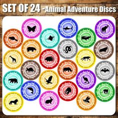 a set of 24 creature power discs with different animals and numbers on them, all in various colors