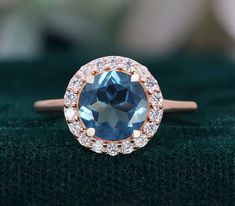 If you would prefer a custom ring, please contact us. PRODUCT DETAILS: Sku Number RG8980 8.00 mm Round London Blue Topaz Gemstone  Accents: Moissanite Plating - 14k Rose gold  TYPES OF PLATING, VERMEIL & THEIR BENEFITS: 1) Rhodium Plating: Rhodium is a precious metal that is in the family of platinum. There are many upsides of rhodium plated jewelry. First, it increases shine, luster and durability. Additionally, it makes jewelry more resistant to scratches and less prone to tarnish. Rhodium pla Rose Gold Rings With Blue Topaz, Blue Topaz Ring For Proposal, Rose Gold Ring With Blue Topaz, Blue Topaz Ring With Halo, Rose Gold Round Topaz Birthstone Ring, Rose Gold Topaz Ring With Birthstone, Rose Gold Topaz Ring, Rose Gold Blue Topaz Ring, Wedding Ring Dainty