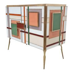 an art deco cabinet with multicolored squares on it