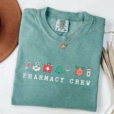 This Pharmacy Squad Unisex Comfort Colors Christmas Group T-shirt exudes a festive and joyful vibe, perfect for groups celebrating the holiday season together. The comfortable fit and classic crew neckline make it versatile for casual and semi-formal settings, ideal for those looking to spread holiday cheer with their pharmacy buddies. Product features - Available in multiple sizes from S to 4XL - Double-needle stitching for durability - Garment-dyed fabric for soft color and texture - Made with Pharmacy Technician, Group Shirts, Color Care, Pharmacist, Christmas Tees, Dyed Fabric, Christmas Colors, Soft Colors, Pharmacy