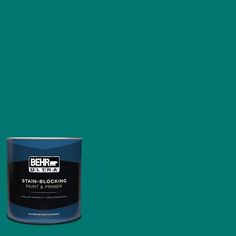 a can of behro ultra stain - blocking paint on a green background,