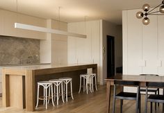 the kitchen is clean and ready to be used as a dining room or office space