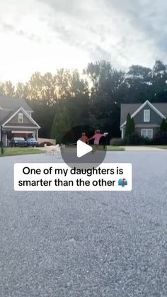 a person riding a skateboard down a street next to some houses with text that reads, one of my daughters is smarter than the other