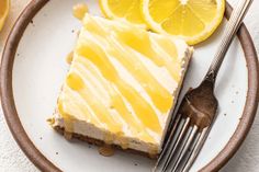 a piece of lemon cake on a plate with a fork