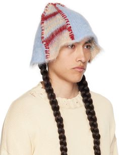 Shag knit bucket hat in tan, blue, and red. · Stripes, stitching, and exposed seams throughout · Paneled construction Supplier color: Tan Red Crochet Hat, Weird Hats, Mohair Hat, Knit Bucket Hat, Fashion Factory, Striped Hat, Exposed Seams, Knitting Machine, Knit Hat