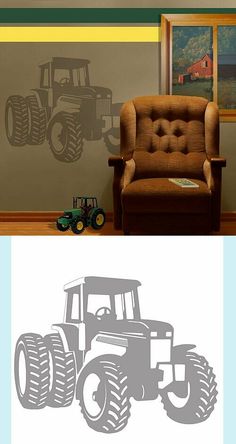 a chair sitting in front of a window next to a wall with tractor stencils on it