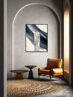 a chair and table in a room with an arch on the wall above it is a painting