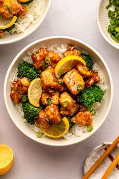 three bowls filled with chicken and broccoli on top of rice next to chopsticks