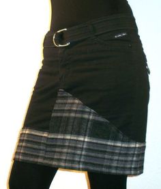 a woman wearing black tights and a skirt with a plaid pattern on the side