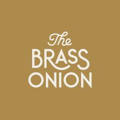 the brass onion logo on a brown background