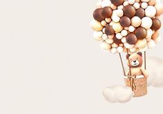 a teddy bear in a hot air balloon with balloons attached to it's back