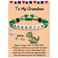 a green and black bracelet with the words to my grandson on it