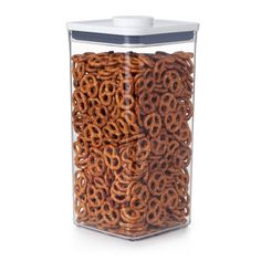 a glass container filled with pretzels on a white background