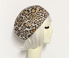 Beret hat made with printed micro-polyester / cotton leopard print fabric, lined in rayon print, the top of the hat has 6 section crown and has a 1" soft elastic band inside. One size fits most will fit up 22” head size Hand wash / dry Made in USA Hat French, French Beret, Leopard Print Fabric, Talk Of The Town, Beret Hat, Girl With Hat, Up Girl, Hat Making, Print Fabric