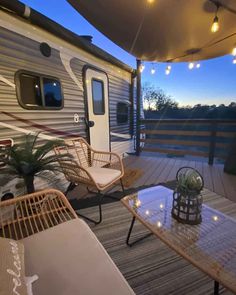 an rv is parked on the deck at night