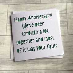 a piece of paper that says happy anniversary we've been through a lot together and most of it was your fault