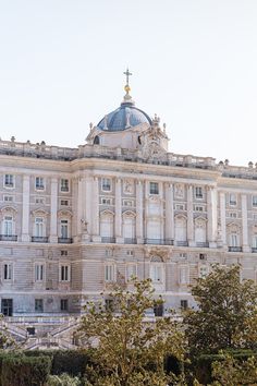 an ornate building with a cross on top