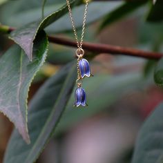 Our bluebell flower necklace adds elegance to any outfit and make a fabulous Christmas gift for a flower lover. Each necklace is hand finished in blue enamel. This beautiful necklace embodies nature with its intricate realistic design and attention to detail. Designed by us, in our London office. The Bluebell is a symbol of gratitude, humility and ever lasting love. It is also the flower to celebrate that Spring has arrived and the warmer Summer months will soon follow. Bluebells are the birth f Bluebell Necklace, Mischievous Spring, Bluebell Flower, Blue Bell Flowers, London Office, White Jewelry Box, Wire Flowers, Fabulous Christmas, Pendant Necklace Gold