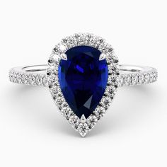 a pear shaped blue and white diamond ring