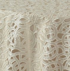 a table cloth with white lace on it