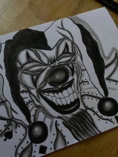 a drawing of a clown's face on a piece of paper