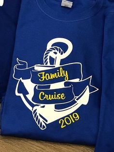 a blue family cruise shirt sitting on top of a table