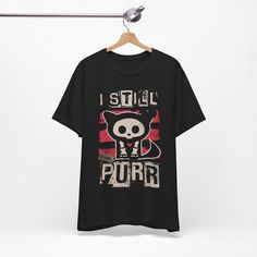 This Unisex Tee features a nostalgic Skelanimals design, perfect for those who love 2000's Scene Emo fashion. The vintage Hot Topic vibe adds a unique touch to any outfit. Ideal for casual wear and layering, this lightweight cotton tee is breathable and comfortable. Perfect for fans of alternative fashion and those looking to add a retro flair to their wardrobe. Great for holidays like Halloween or everyday wear for those who appreciate quirky, edgy styles. Product features - Side seams for stru Funny Print Cotton Top In Alternative Style, Alternative Cotton Tops With Funny Print, Cotton Shirt With Graphic Print For Alternative Fashion, Cotton Graphic Print Shirt For Alternative Fashion, Emo Style Cotton Tops With Graphic Print, Alternative Cotton Top With Funny Print, Edgy Cotton Shirt For Halloween, Cotton Top With Skull Print For Alternative Fashion, Emo Cotton Tops With Graphic Print