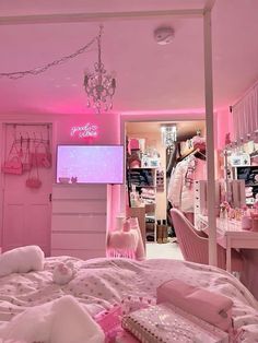 a bedroom with pink walls and furniture in the room is lit up by neon lights