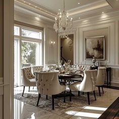 an elegant dining room with chandelier and chairs