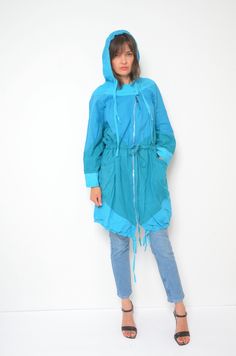 80s hooded zipper oversized jacket. Colorful tie waist light coat. Spring summer festival wear. - Label: n/a - Era: 1980's  - Color: light blue , green - Fabric: 100% cotton - Condition: very good. Ready to wear. - Tag Size:  - Fits: large MEASUREMENTS:  *Bust: 51.2" (130 cm)  *Waist: 44.8" (114 cm) *Sleeve Length (from the armpit to the wrist): 16.5" (42 cm)  *Length: 36.6" (93 cm) Oversized Hooded Spring Windbreaker, Oversized Hooded Windbreaker For Spring, Trendy Oversized Parka For Spring, Blue Long Sleeve Outerwear With Drawstring, Trendy Oversized Spring Parka, Spring Oversized Parka With Adjustable Hood, Oversized Parka With Drawstring Hood For Spring, Spring Outdoor Cotton Parka, Spring Streetwear Hooded Parka