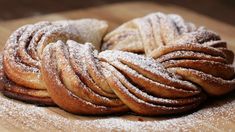 some sugary breads are on a wooden table