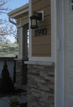 a house number sign on the side of a building