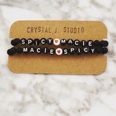 "Create your own couples bracelet set. Perfect gift for lovebirds, new parents or pros! One bracelet is cool white and grey howlite with white letters. The other is black lava rock with black letters. So fun to wear as a couple 🤍🖤 Personalize with each of your names or your cutesy little pet names for each other or whatever you choose:  * All letters are upper case * Use the 'Personalize' box at checkout to list your word(s). * Listing includes (2) bracelets. One for you, one for bae. :) * Set as shown includes one white bracelet in 7\"/women's size and one black bracelet in 8.5\"/men's size. But you can get both black or white too!  Handmade with love. 💎 Great baby shower gift - show the new parents some love too!!" His And Hers Bracelets, Couples Bracelets, Name Bracelets, Bracelets Beaded, Couples Bracelet, White Bracelet, Iron On Fabric, Black Bracelet, Personalized Bracelet