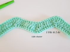 the crochet pattern is being used to make a wavy stitch for a scarf