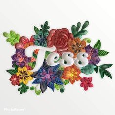 colorful paper flowers with the word yes spelled in it