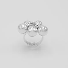 "DON 925's master silversmiths handcrafted with genuine sterling silver this statement ring that features a fun spheres design. Band width: 5 mm (0.20\") Approx. sphere size: 9 mm (0.35\") Weight: 10 grams (0.35 oz) Stamped with \"925\" the quality hallmark and place of origin \"Mexico\". Best way to keep your item shiny and clean is by leaving it on while you wash your hands with warm soapy water, dry ring thoroughly and gently. ★Premium DON925 bag included ★FAQs: https://www.etsy.com/shop/don9 Modern Handmade Sterling Silver Dome Ring, Modern Handmade Dome Ring In Sterling Silver, Modern Dome Ring Gift, Unique Sterling Silver Dome Ring, Silver Dome Ring With Polished Finish, Unique Silver Orb-shaped Jewelry, Modernist Sterling Silver Dome Ring As Gift, Modernist Silver Dome Ring For Gift, Modernist Silver Dome Ring As Gift