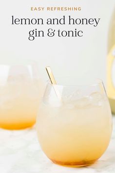 two glasses filled with lemon and honey gin and tonic on top of a marble table