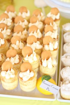 cupcakes and pastries are displayed on a tray