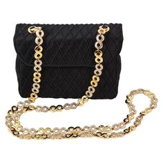 Judith Leiber crossbody bag Black satin with diamond thread pattern Hidden gold snap closure Gold rhinestone infinity chain strap Black satin lining Inner card slot and zippered pocket Comes with black coin purse, gold mirror and blue dust-bag Elegant Crossbody Shoulder Bag With Gold Chain, Formal Crossbody Bag With Chain Detail, Luxury Bags With Gold Clasp For Formal Occasions, Formal Chain Crossbody Bag, Evening Crossbody Bag With Gold Chain, Gold Chain Crossbody Bag For Evening, Formal Shoulder Bag With Chain, Classic Formal Shoulder Bag With Chain, Classic Gold Bag With Chain Detail