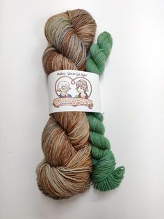 two skeins of yarn sitting next to each other