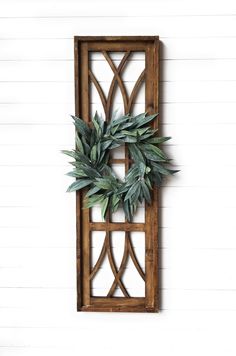 a wooden frame with a wreath hanging on it