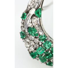 This is part of Chairish’s Fine Jewelry assortment.  Emerald Diamond Crescent Brooch 14K  This Emerald Diamond Crescent Brooch is made up of 7.52 Carats of Emeralds and 3.34 Carats of Diamonds. Furthermore, it is a large C shape brooch. Also, there are 4.95 carats of emerald cut Emeralds, 1.95 carats of oval Emeralds and Triangle Emeralds 0.62 carats. The Diamond round cuts are 2.60 Carats and the Baguette Diamonds total 0.74 Carats. The stone clarity on the Emeralds are Green to slightly bluish Mens Silver Jewelry, Baguette Diamonds, Bluish Green, Baguette Diamond, Emerald Diamond, Emerald Cut, Crescent, Silver Jewelry, Emerald