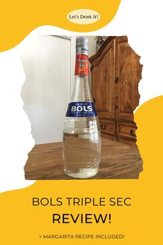 a bottle of bols triple sec is on the table next to a wooden cabinet