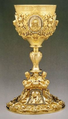 a golden cup with an ornate design on it