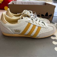 Adidas Japan Shoes Size 7.5 Women, 6 Men Colour Off White / Spark / Orange Tint (Looks More Mustard) Product Code Ig2011 Sold Out On Adidas Website; Brand New In Box Adidas Japan Shoes Outfit, Classic Yellow Sneakers With Rubber Sole, Classic Yellow Sneakers With Round Toe, Classic Yellow Sneakers With Gum Sole, Vintage Yellow Sneakers With Round Toe, Yellow Sneakers With Perforated Toe Box, Vintage Yellow Sneakers With Gum Sole, Vintage Yellow High-top Sneakers, Vintage Yellow Sneakers For Sports