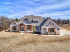 a large house in the middle of a field