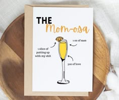 a card with the words, the momosa and an illustration of a glass of champagne